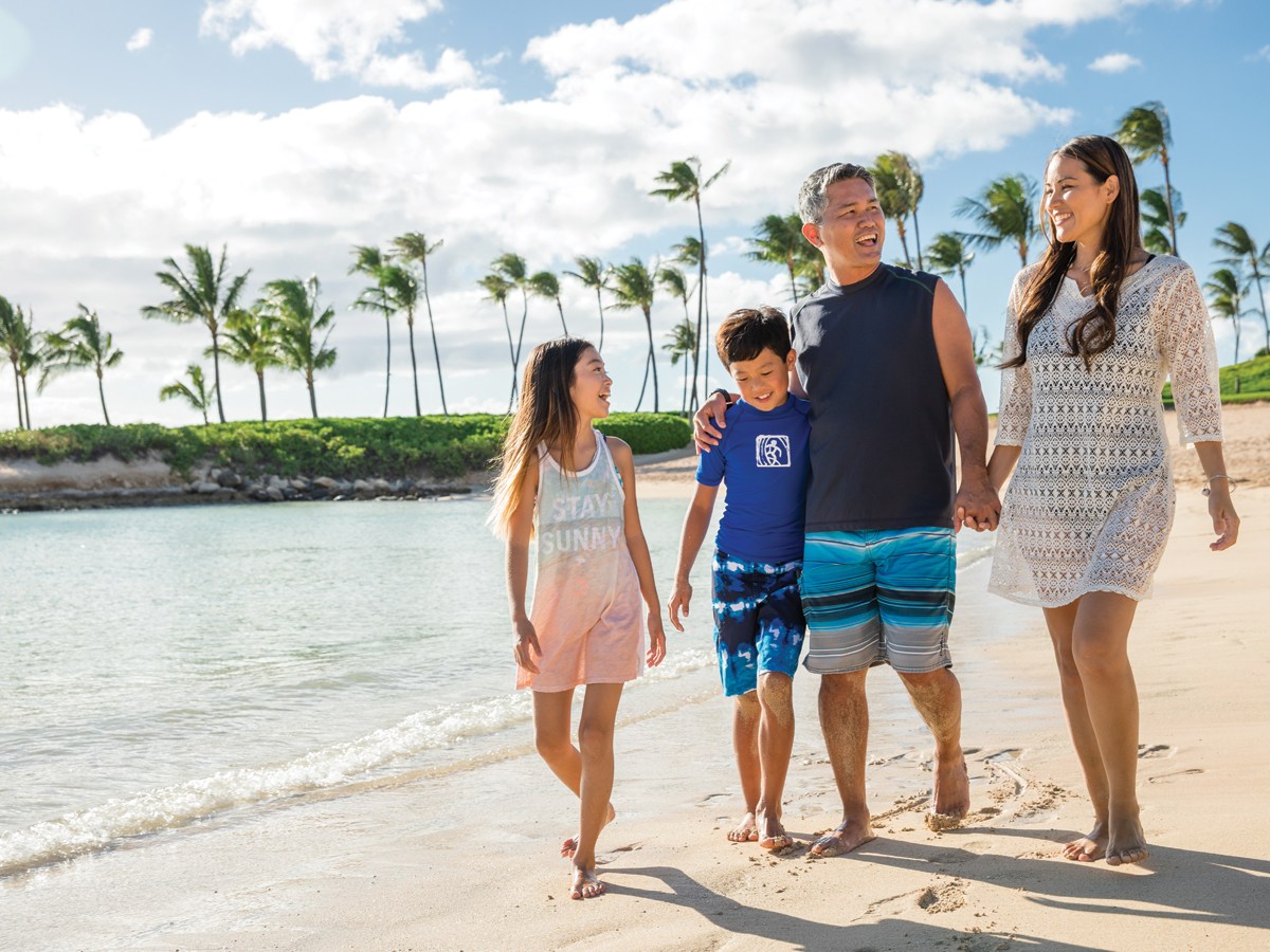 Family walking along the beach